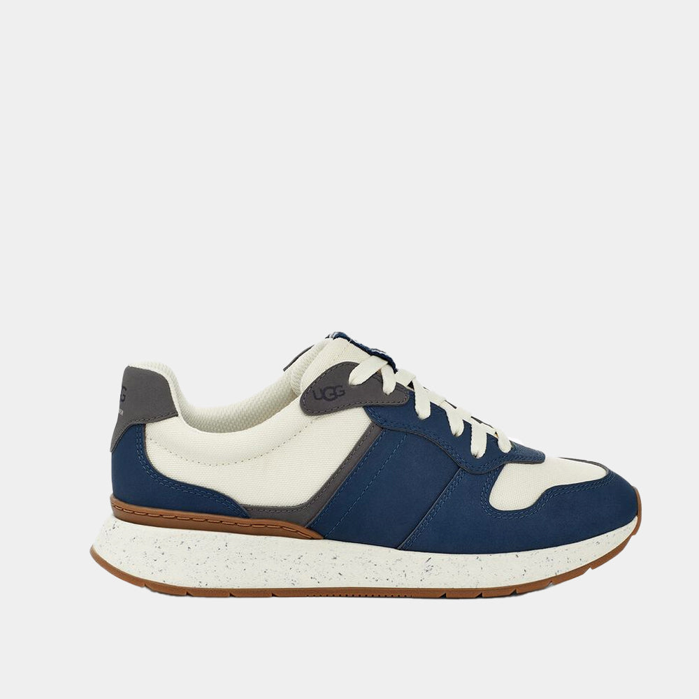 Baskets UGG Retrainer en cuir et tissu marine et blanc, vue de profil – baskets femme | Ann Tuil
